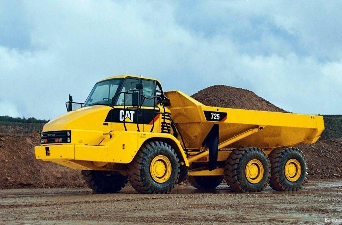 Сочлененный самосвал Катерпиллер