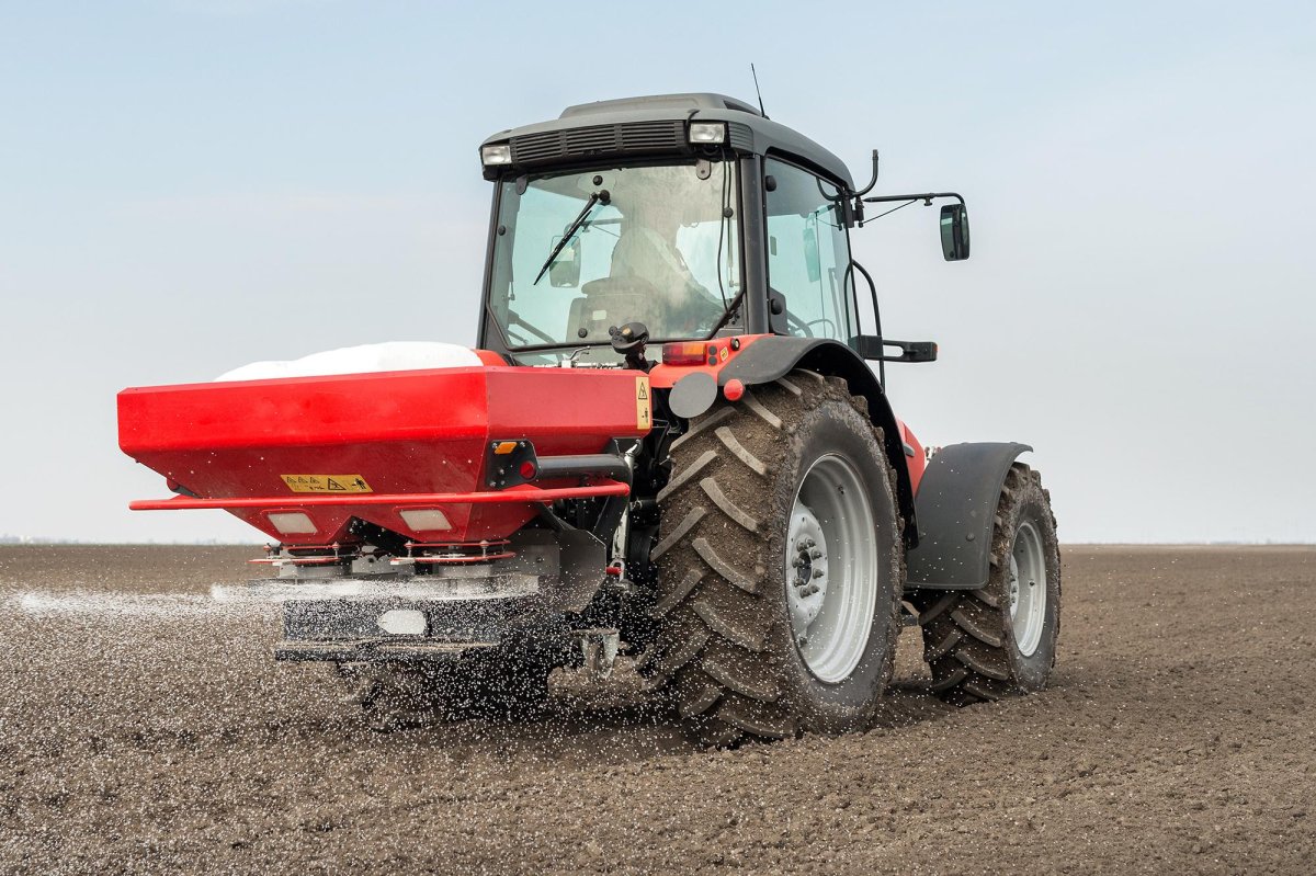 The tractor is Spreading Fertilizer