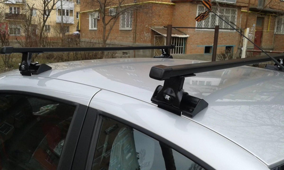 Багажник муравей для а/м Lada Kalina SD/HB, Lada Granta с дугами 1,2м- штатное место