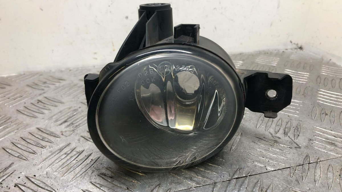 19c911012b TYC Astra j 5d 12- фара противотуманная правая