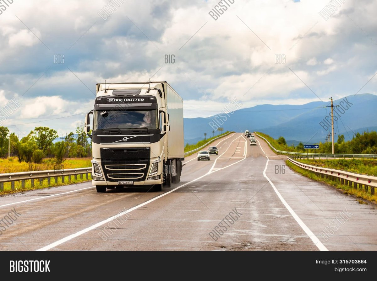 White Volvo Truck and Trailer