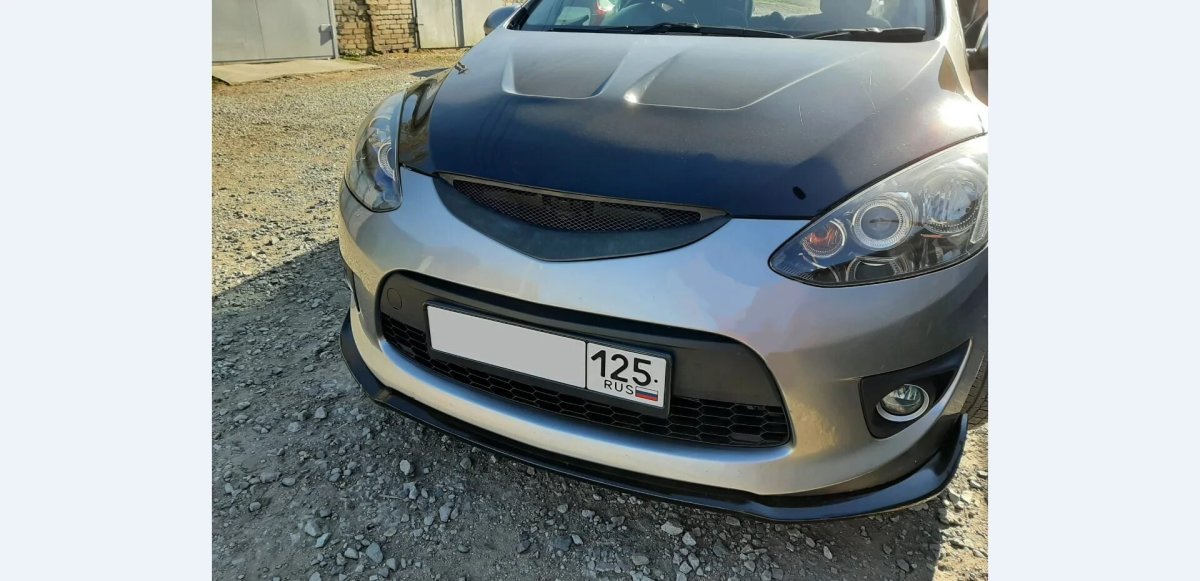 Как снять решетку на бампере Мазда Демио 2010 года выпуска