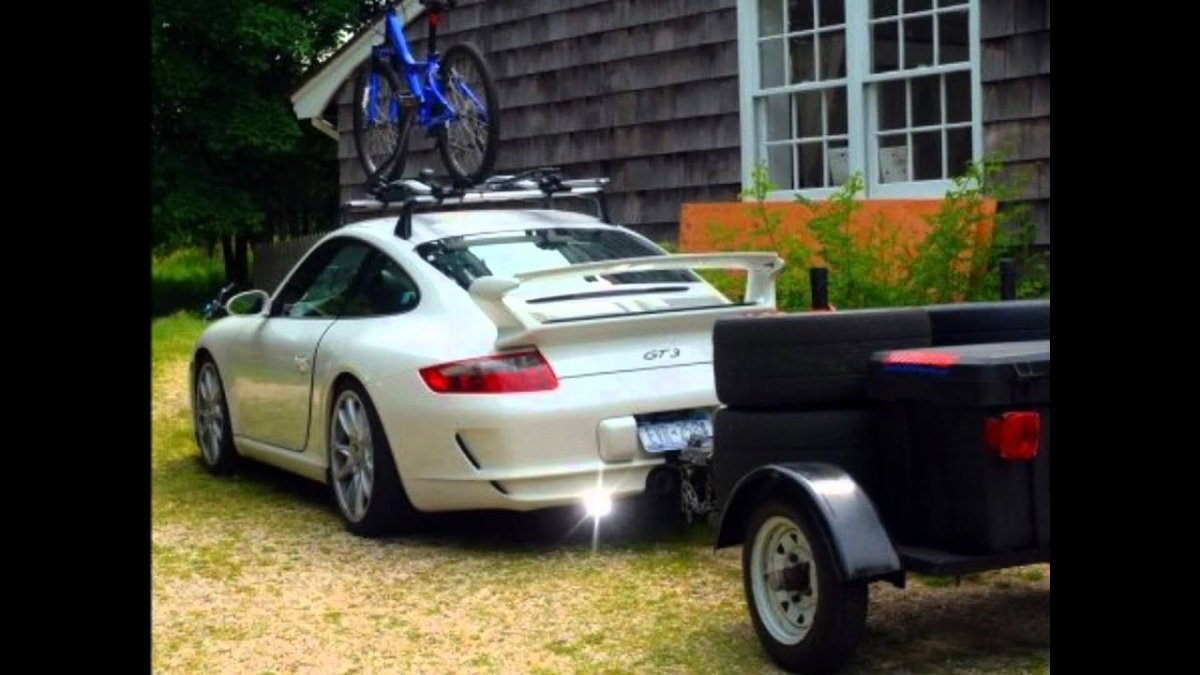 Порше 911 с прицепом