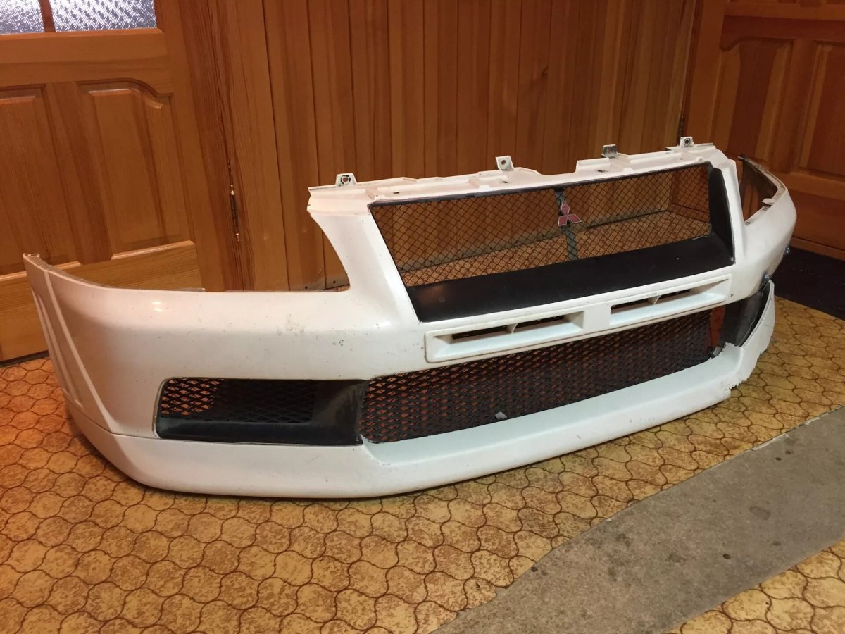 Бампер передний Mitsubishi Lancer 9